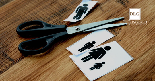 paper with image of family on it cut up by scissors