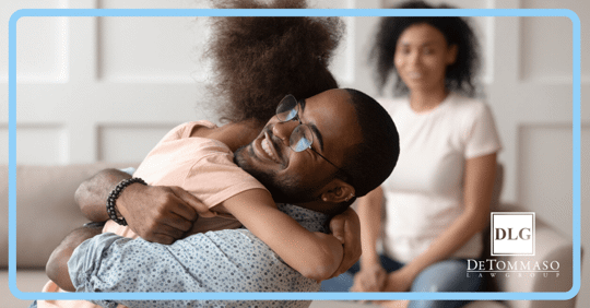 child hugging father