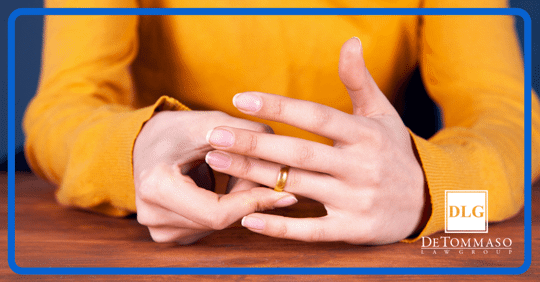 lady taking off wedding ring