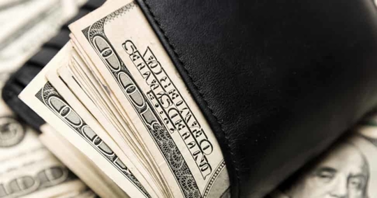 $100 bills in wallet