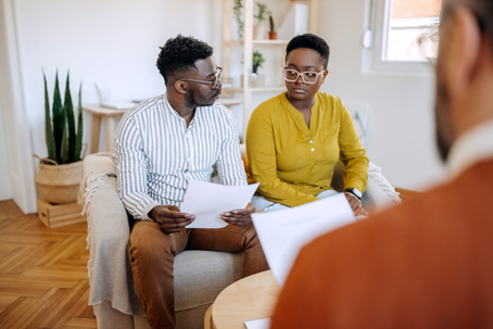 couple reviewing documents with a lawyer