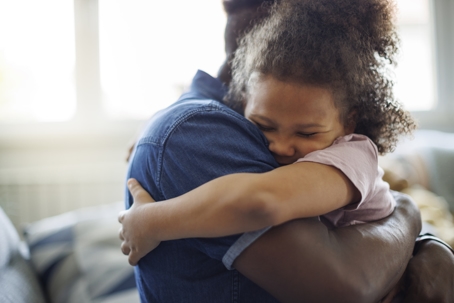 daughter hugging father
