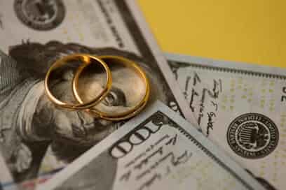wedding rings over $100 bills